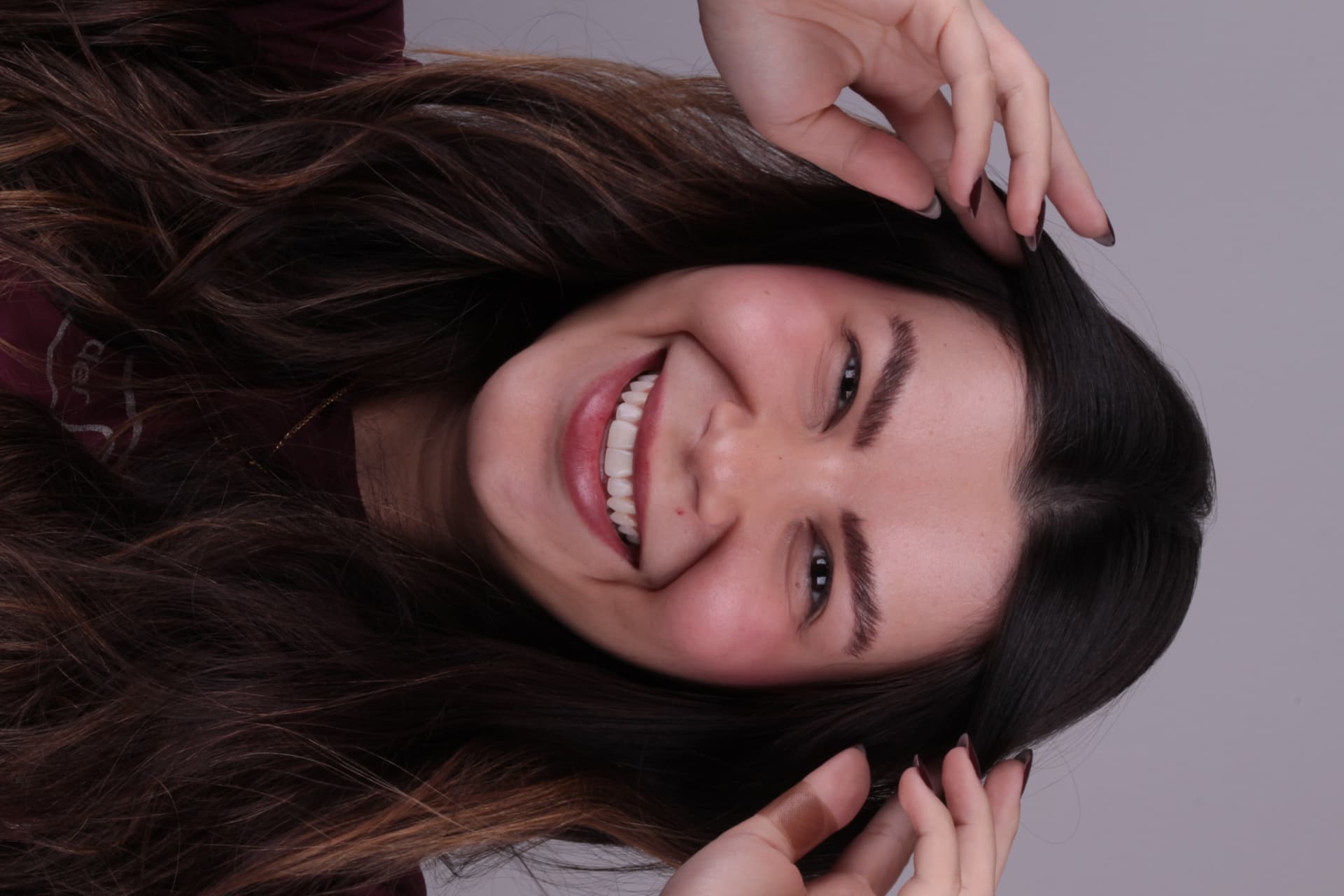 Paciente sorrindo após o tratamento
